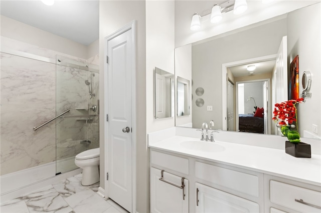 bathroom with marble finish floor, toilet, vanity, and a marble finish shower