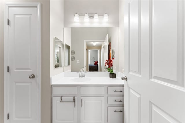 ensuite bathroom with vanity and ensuite bath