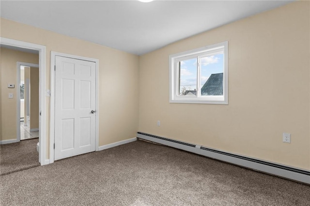 unfurnished bedroom featuring carpet, baseboards, and baseboard heating