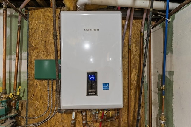 utility room featuring water heater