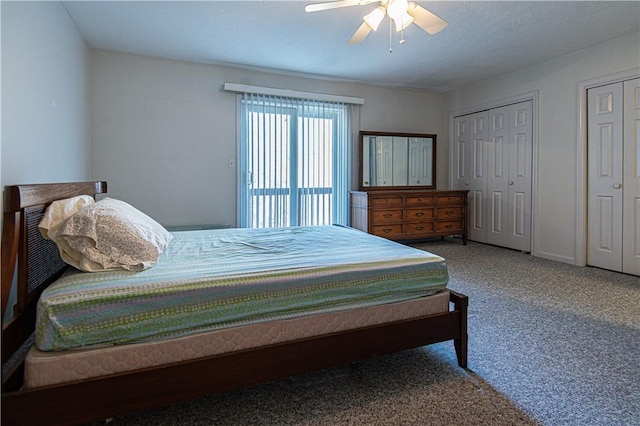 carpeted bedroom featuring ceiling fan, baseboards, and multiple closets