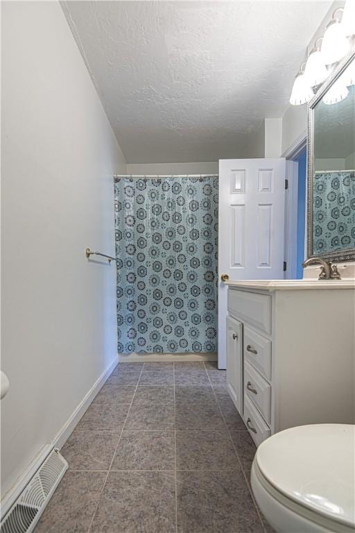 full bathroom with visible vents, toilet, vanity, a textured ceiling, and baseboards