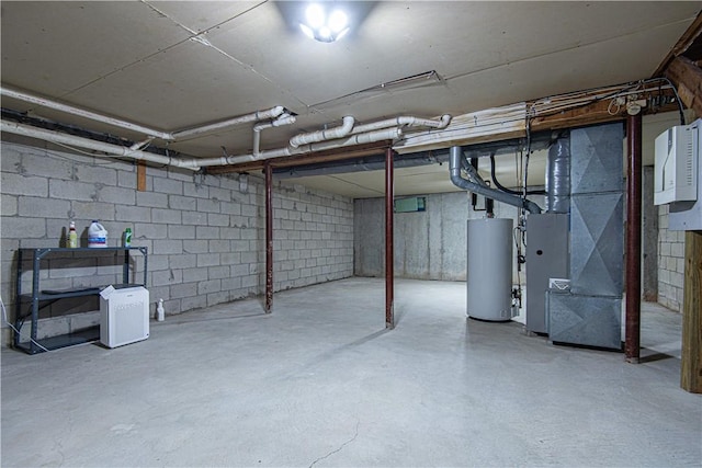 unfinished below grade area featuring water heater and heating unit