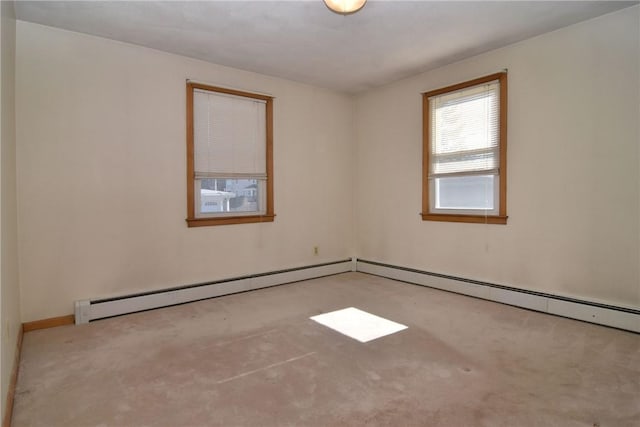 carpeted empty room featuring a baseboard radiator