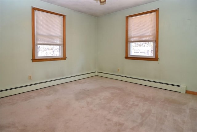 unfurnished room featuring carpet floors and a baseboard radiator