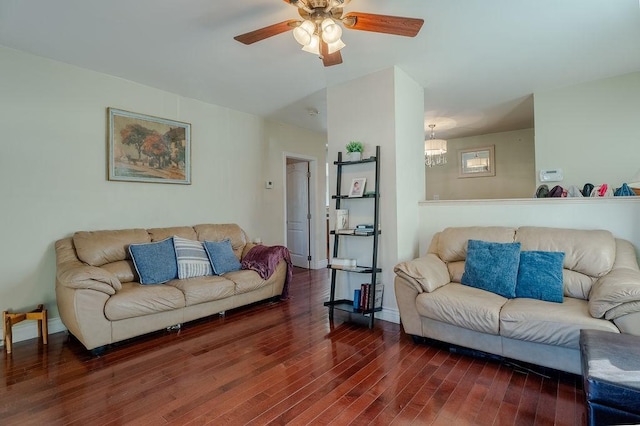 living area with ceiling fan, baseboards, and wood finished floors