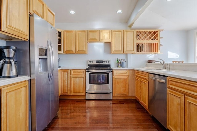 kitchen featuring dark wood-style flooring, open shelves, light countertops, appliances with stainless steel finishes, and a sink