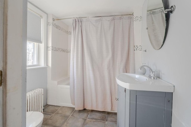 bathroom with toilet, radiator heating unit, tile patterned floors, shower / bathtub combination with curtain, and vanity