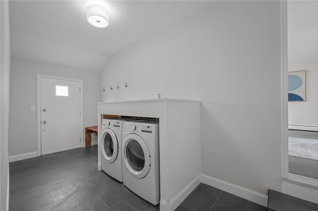 laundry area featuring baseboards, laundry area, and washer and clothes dryer