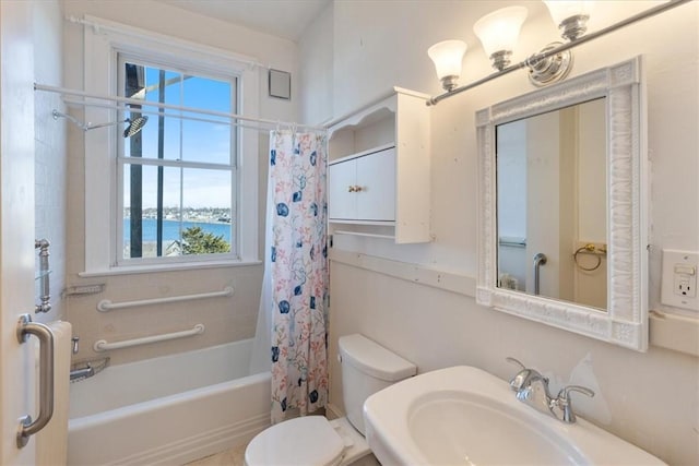 full bath featuring toilet, shower / bath combination with curtain, plenty of natural light, and a sink