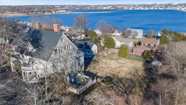 drone / aerial view with a residential view and a water view