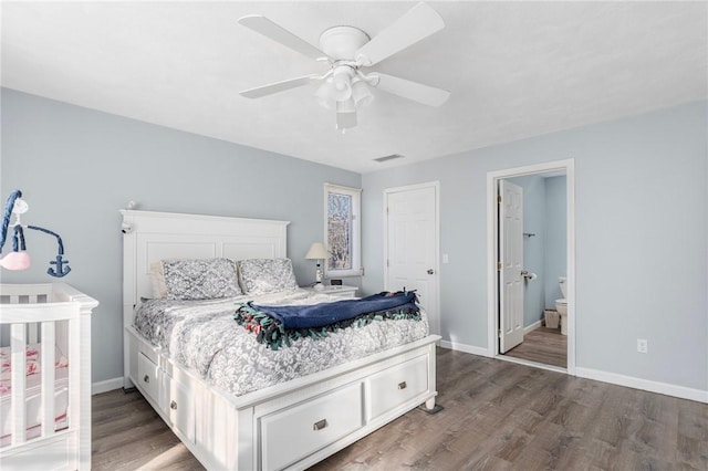 bedroom with a ceiling fan, wood finished floors, visible vents, and baseboards