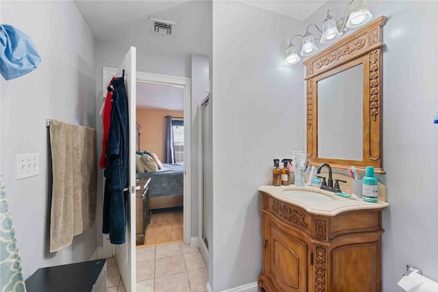 full bathroom with tile patterned flooring, vanity, visible vents, a stall shower, and ensuite bath