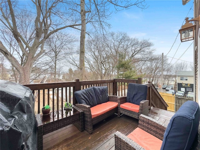 wooden terrace featuring outdoor lounge area