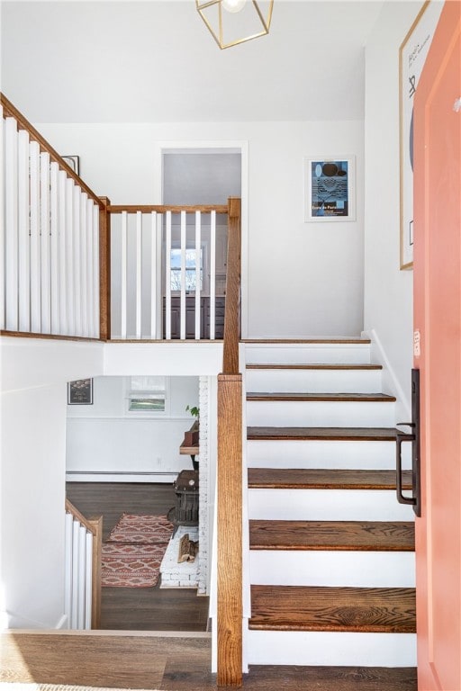 stairway with wood finished floors