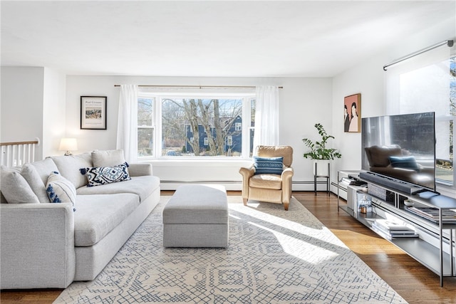 living room featuring baseboard heating and wood finished floors