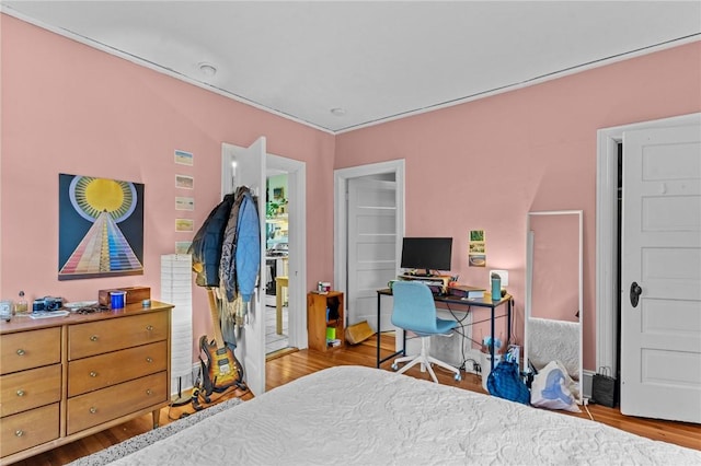 bedroom featuring wood finished floors