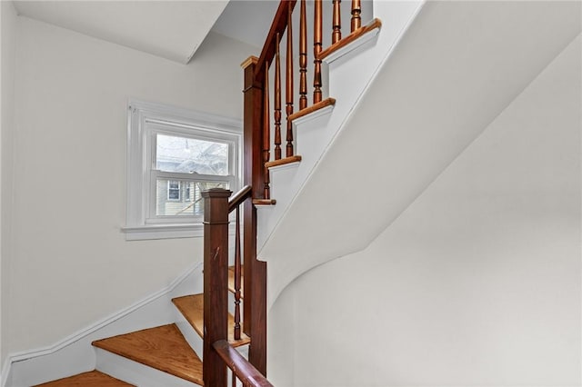 stairway featuring baseboards