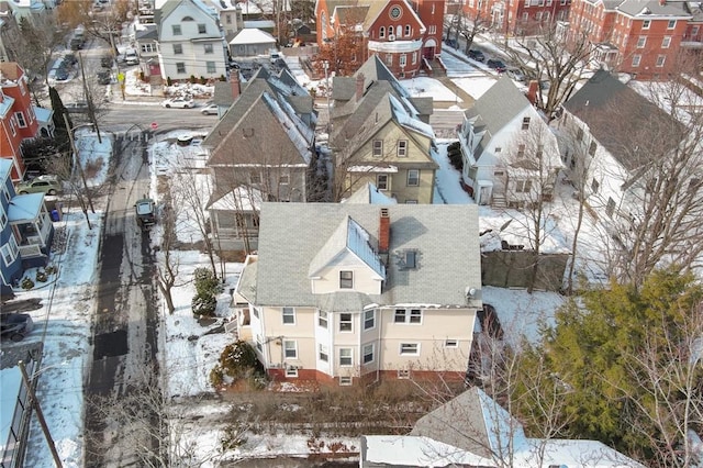 snowy aerial view with a residential view