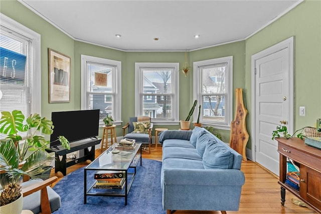 interior space with ornamental molding, light wood-type flooring, and recessed lighting