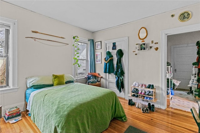 bedroom with wood finished floors