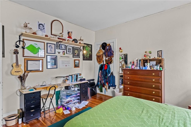 bedroom with wood finished floors