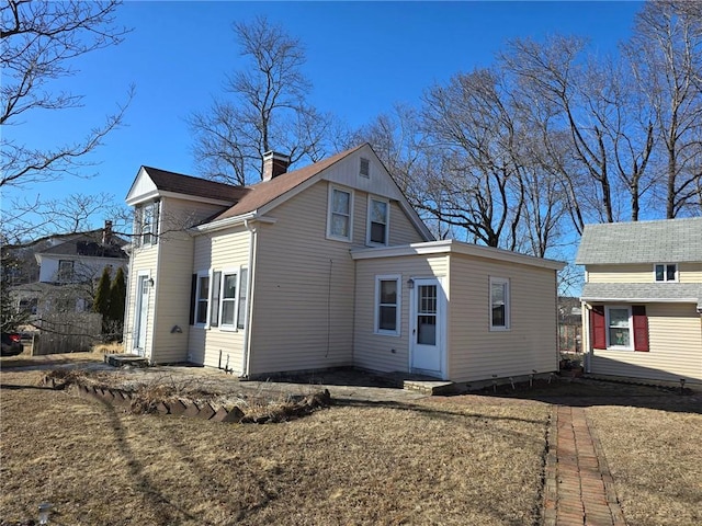 exterior space featuring a chimney