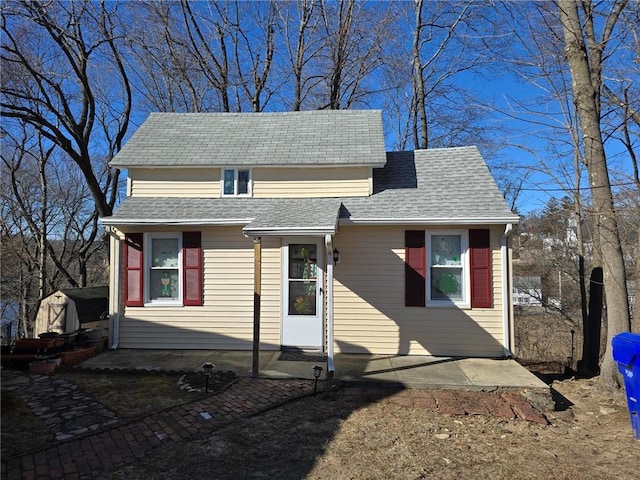 view of front of house with roof with shingles