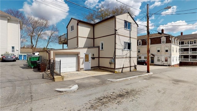 view of side of property with a garage