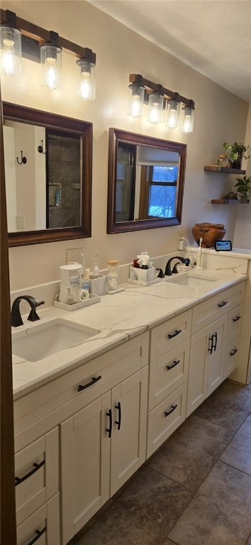 full bathroom featuring double vanity, vaulted ceiling, and a sink