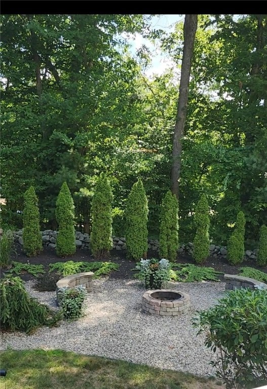 view of yard with an outdoor fire pit