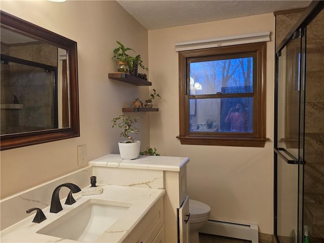 full bath with toilet, a baseboard heating unit, a textured ceiling, a shower stall, and vanity