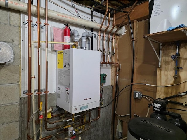 utility room featuring water heater