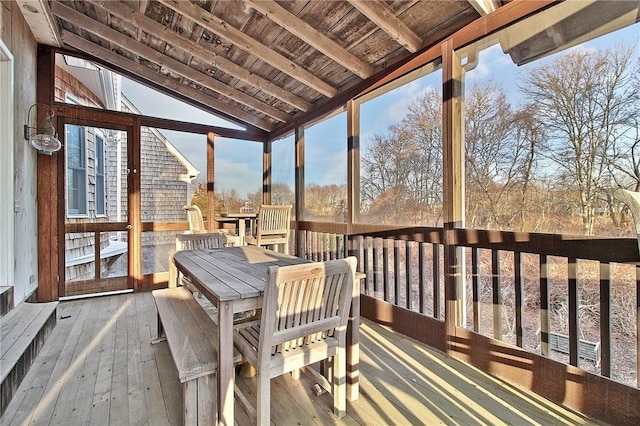 sunroom / solarium with lofted ceiling and wooden ceiling