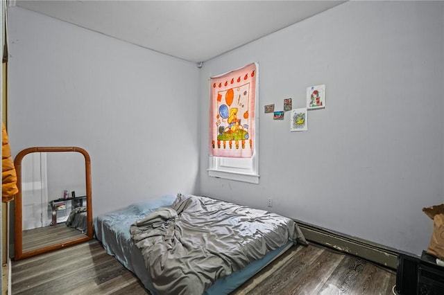 bedroom featuring wood finished floors