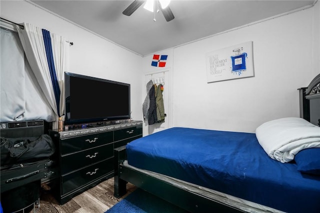 bedroom with ceiling fan and wood finished floors