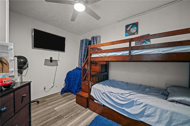 bedroom featuring ceiling fan and wood finished floors