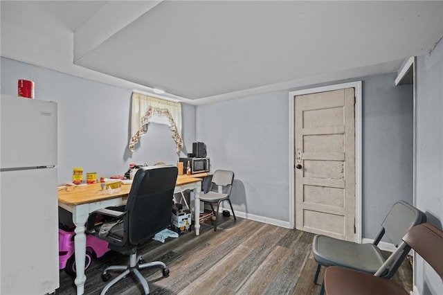 home office with wood finished floors and baseboards