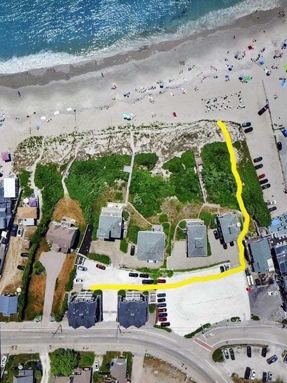 birds eye view of property with a beach view