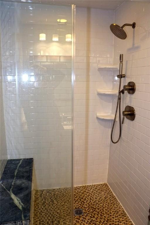 bathroom with a shower stall