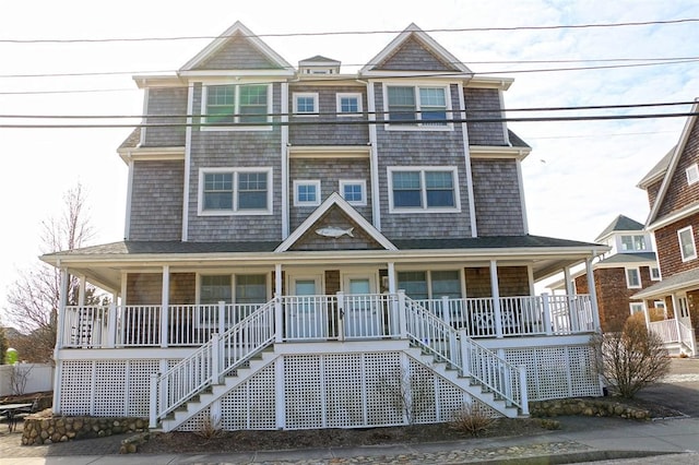 view of front facade featuring stairs and a porch