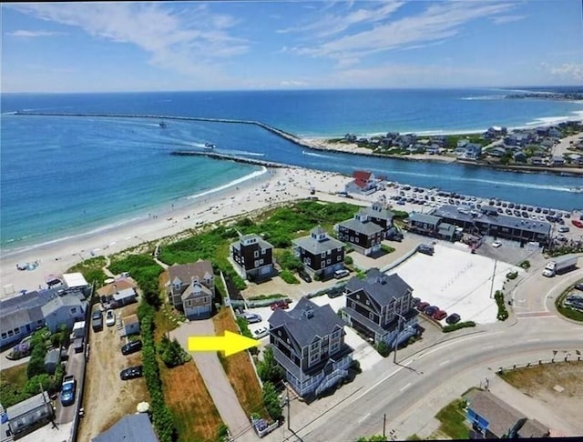 bird's eye view with a water view and a view of the beach