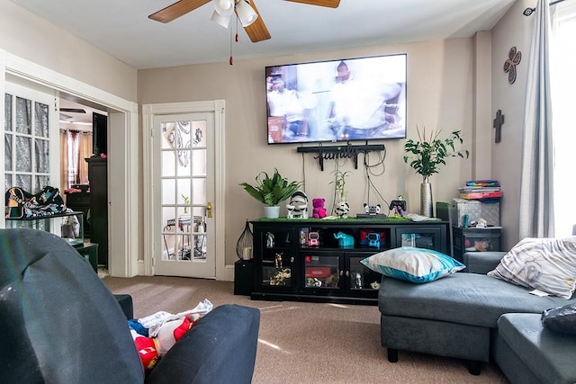 living room with carpet floors and ceiling fan