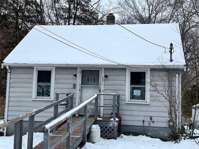 view of front of house with a chimney