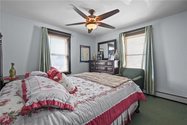 bedroom with carpet floors, a baseboard heating unit, and a ceiling fan