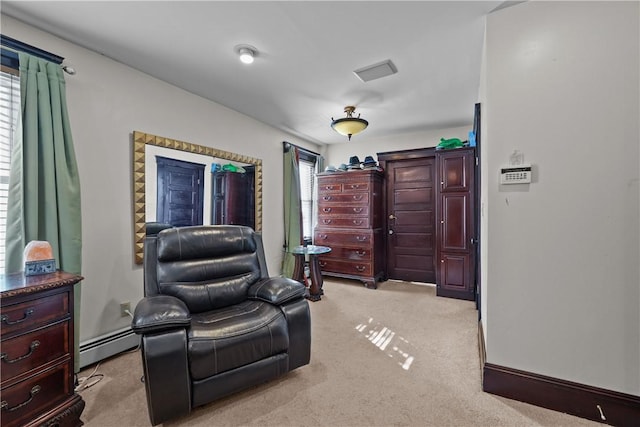 living area with light carpet, baseboards, and baseboard heating