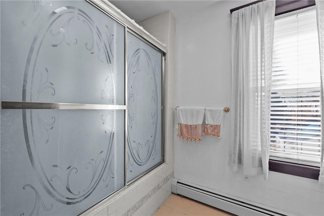 bathroom featuring a baseboard radiator, a shower with shower door, and tile patterned floors