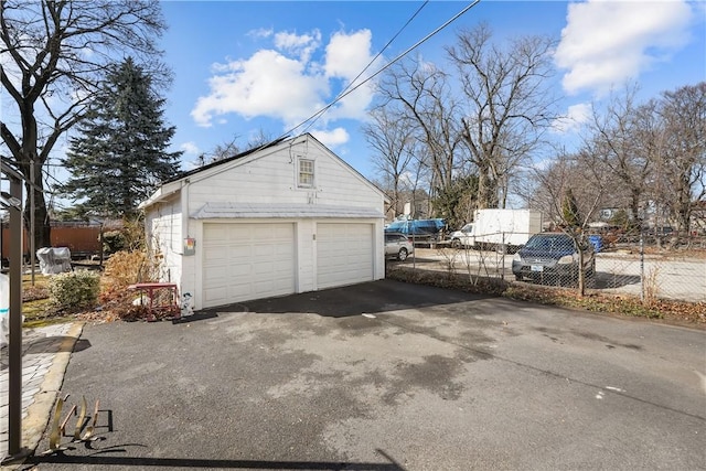 garage featuring fence