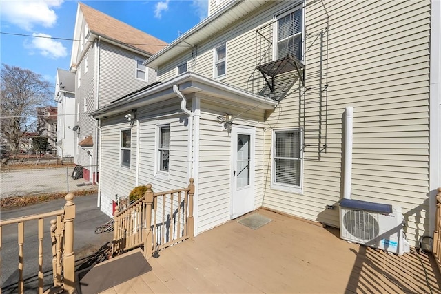 rear view of property featuring ac unit