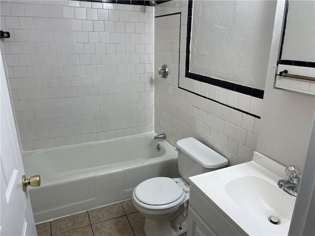 full bathroom featuring toilet, shower / tub combination, tile patterned floors, vanity, and tile walls